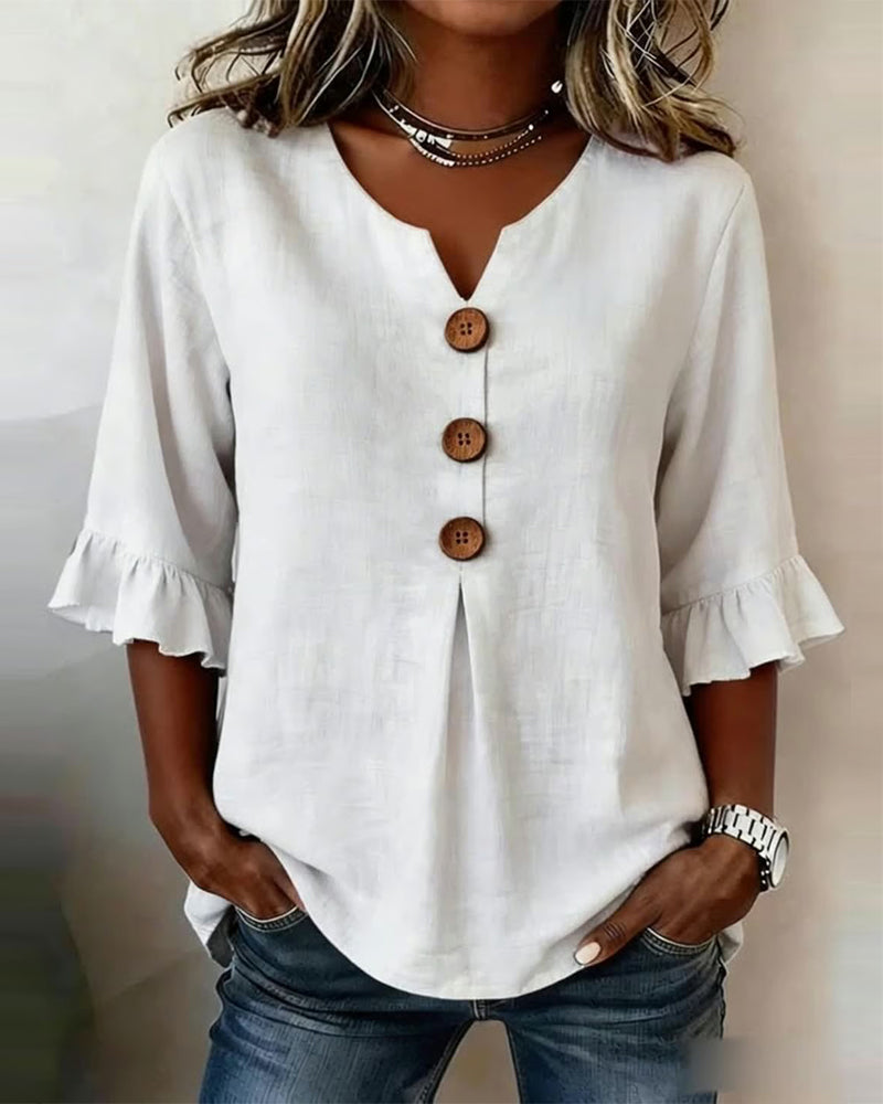 Blusa Sofia in cotone-lino liscio con bottoni effetto legno e volant