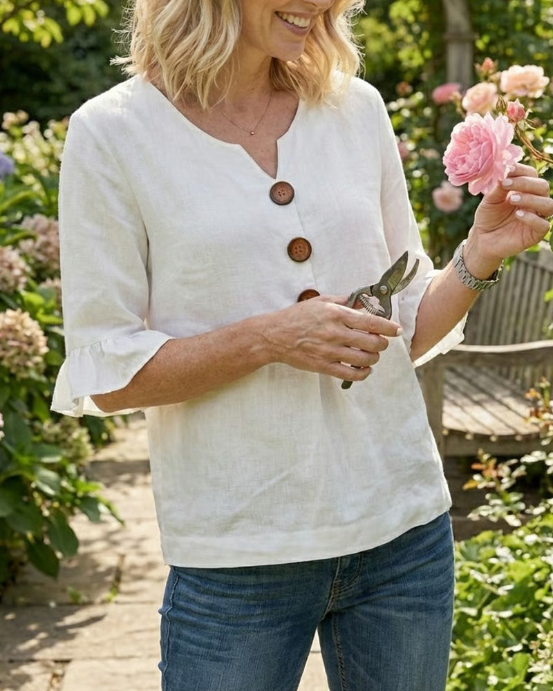 Blusa Sofia in cotone-lino liscio con bottoni effetto legno e volant
