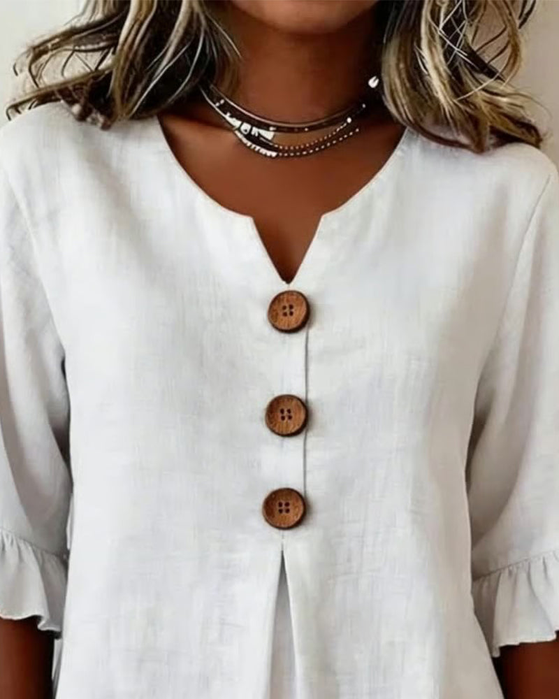 Blusa Sofia in cotone-lino liscio con bottoni effetto legno e volant