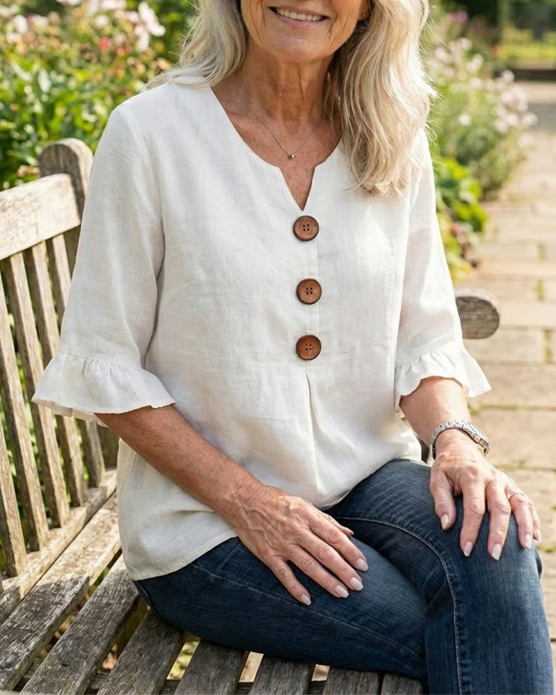 Blusa Sofia in cotone-lino liscio con bottoni effetto legno e volant