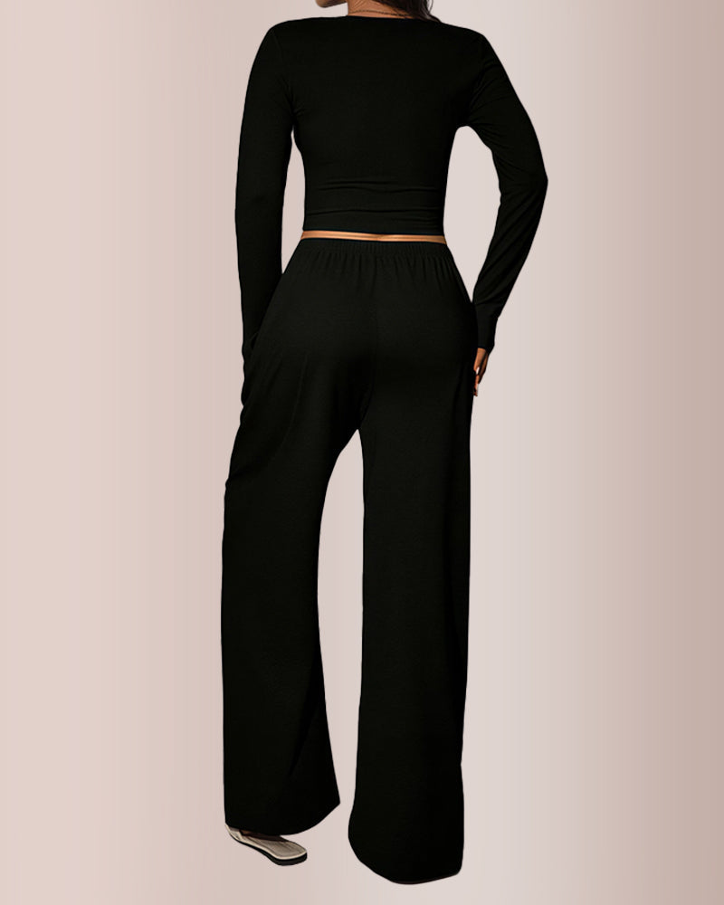 Completo con top corto e pantaloni a gamba larga