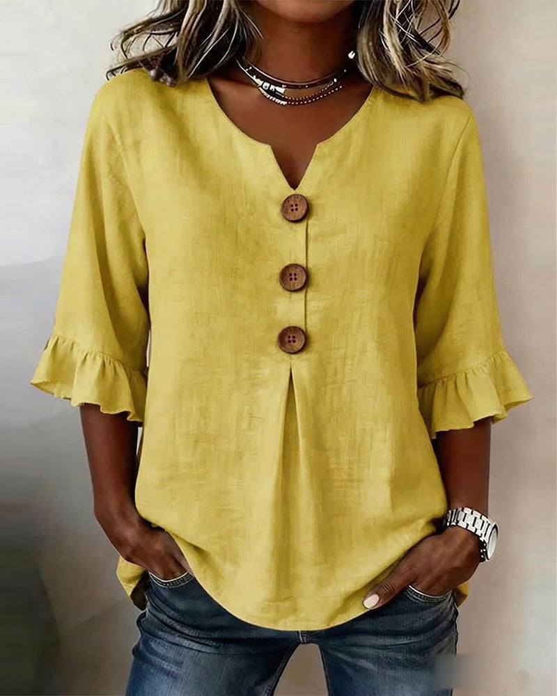Blusa Sofia in cotone-lino liscio con bottoni effetto legno e volant