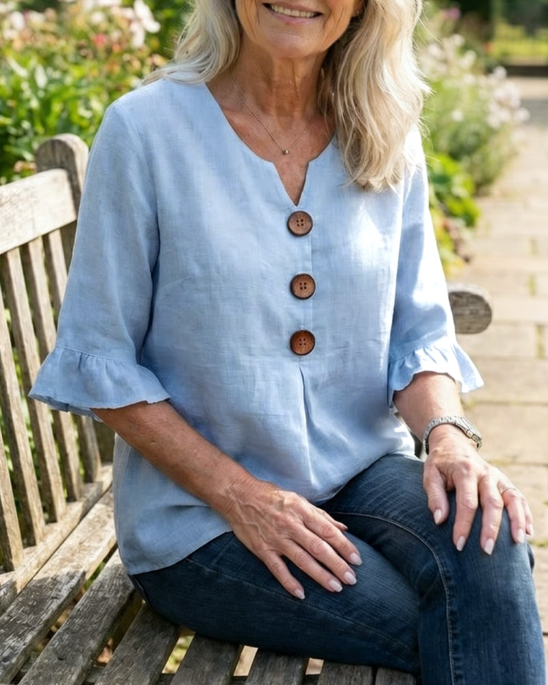 Blusa Sofia in cotone-lino liscio con bottoni effetto legno e volant