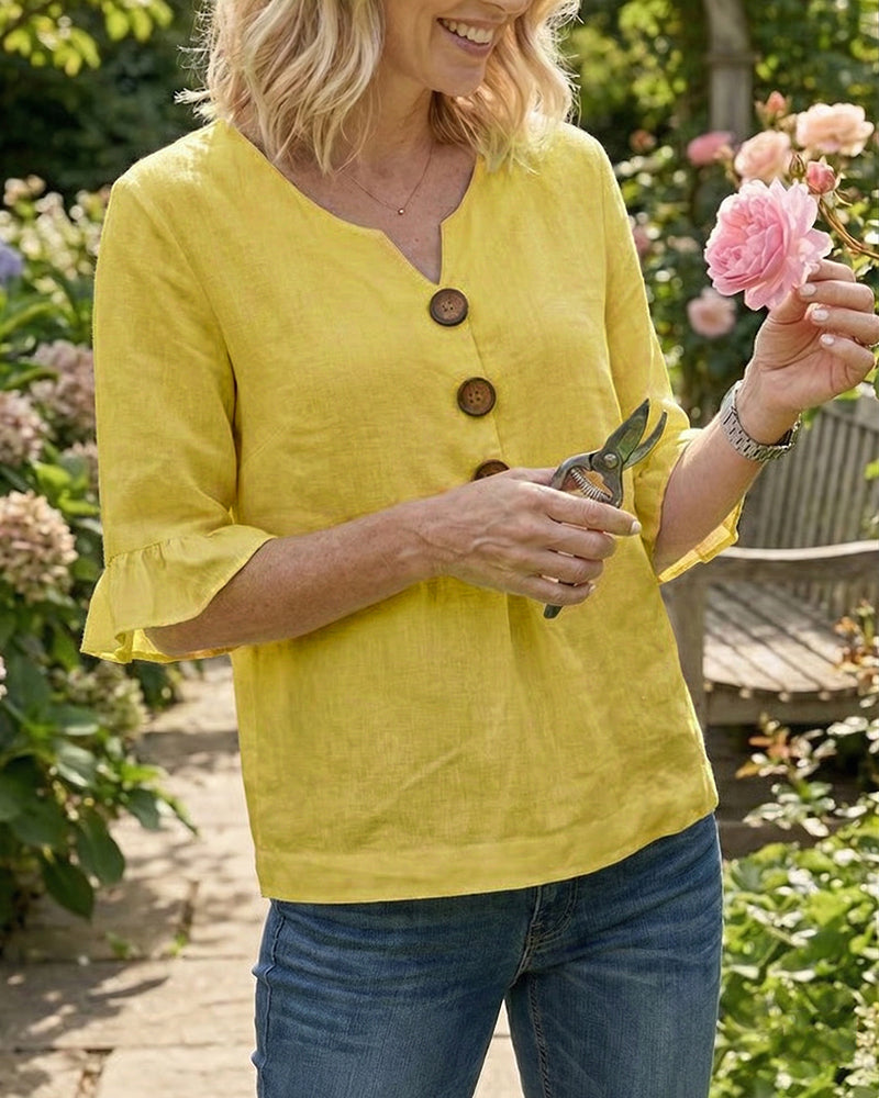 Blusa Sofia in cotone-lino liscio con bottoni effetto legno e volant